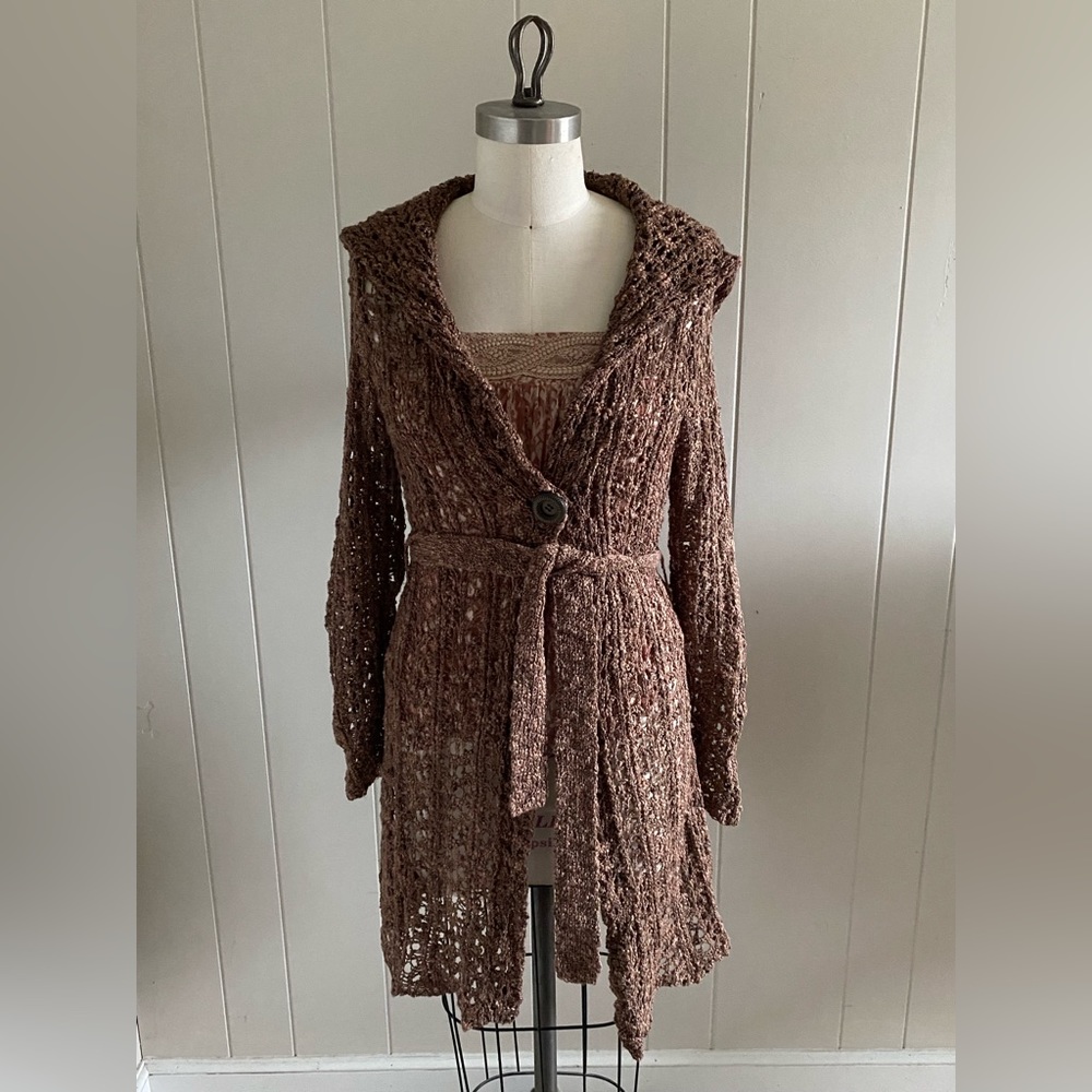 Open crochet long hooded cardigan with belt and special button closure.